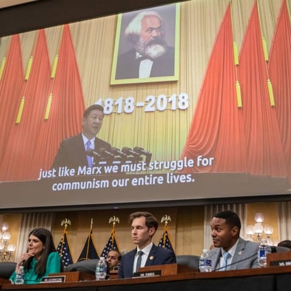 US House committee members watch a video about China’s Communist Party during a hearing in Washington on Tuesday. Photo: Bloomberg