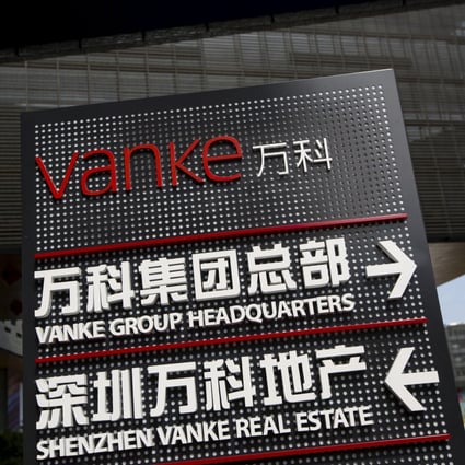 Signs show the direction of Vanke group headquarters in Shenzhen. Photo: Reuters
