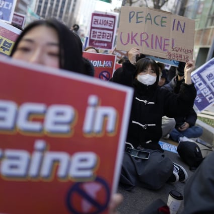 Protesters shout slogans during a rally to mark the one-year anniversary of Russia’s invasion of Ukraine, in downtown Seoul, South Korea, on February 25. Photo: AP