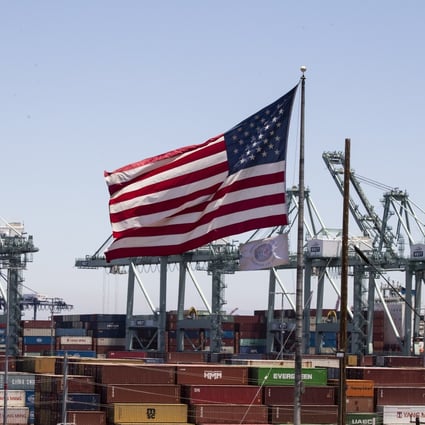 The US flag flies above containers at the Port of Los Angeles in California on July 7, 2022. The end of hyper-globalisation is creating the opportunity to right the wrongs of neoliberalism, but national security establishments in the world’s leading powers are steering the narrative towards conflict. Photo: EPA-EFE