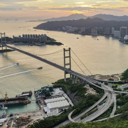 A view of Hutchison United Dockyard Limited’s land (left of the bridge) and the government’s idle plot (right of the bridge) in Tsing Yi on 10 Mar 2023. Photo: Martin Chan.
