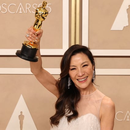 Michelle Yeoh poses with her best actress Oscar backstage at the Dolby Theatre in Los Angeles. The Everything Everywhere All at Once actress is the first who identifies as Asian to win the award in 95 years of the Academy Awards. Photo: Reuters 
