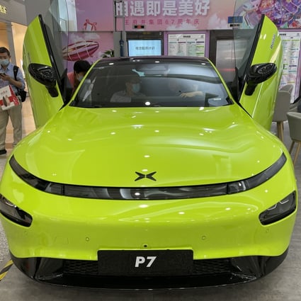 A Xpeng P7 car is displayed at a shopping centre in Beijing. The carmaker is eyeing China’s mass market as demand for premium EVs fades. Photo: Simon Song