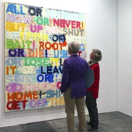 Visitors to Art Basel Hong Kong in 2015 contemplate American conceptual artist Mel Bochner’s “All or nothing”. Text-based art challenges our perceptions of what art is, and our understanding of the meaning of words. Photo: Facebook@Art Basel