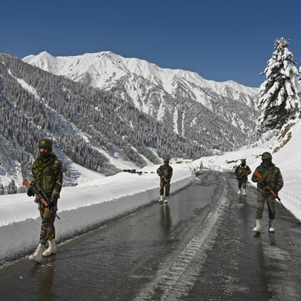 Indian army soldiers guard a road leading to the Ladakh region in February 2021. Photo: AFP