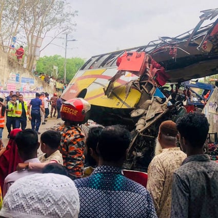 People gather after a fatal bus crash in Bangladesh on Sunday. Photo: AFP