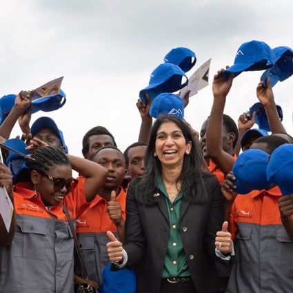 UK Home Secretary Suella Braverman meets graduate builders in Kigali, Rwanda on Saturday. The graduates will be helping to construct houses that could house deported migrants from the UK. Photo: PA Wire / dpa