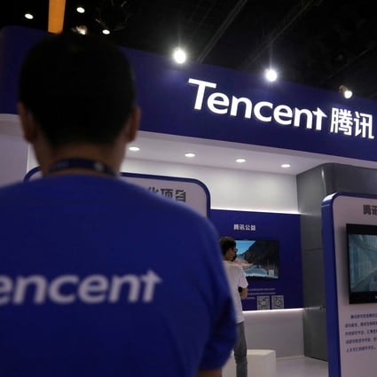 A staff member at the Tencent booth during the China Internet Conference in Beijing, July 13, 2021. Photo: Reuters