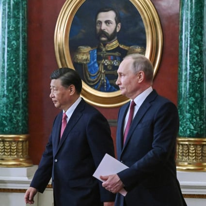 Chinese President Xi Jinping and Russian leader Vladimir Putin arrive to attend a signing ceremony in Moscow on Tuesday. Photo: Kremlin Pool Photo via AP