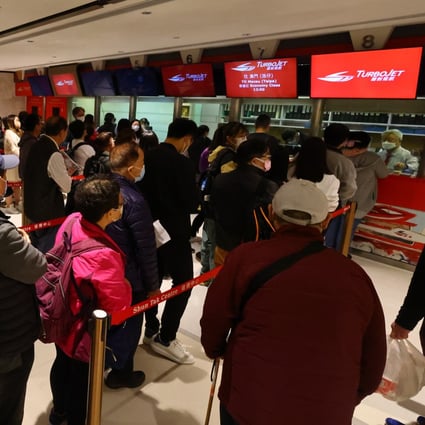 Travellers queue up for tickets at the Macau Ferry Terminal at Shun Tak Centre, on January 13, 2023. Shun Tak Holdings expects tourism activity to pick up this year. Photo: Dickson Lee