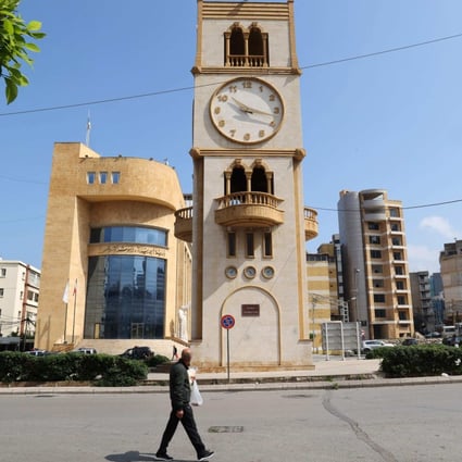 A clock tower in Beirut’s Jdeideh district indicates the time on Sunday after Lebanon’s government announced a decision to delay daylight savings.Photo: AFP
