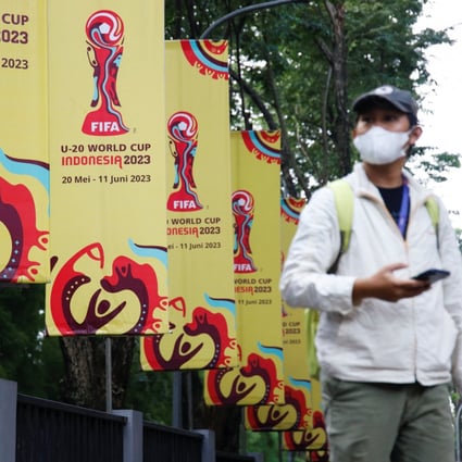 A man walks past Fifa U-20 World Cup banners in Jakarta. Photo: Reuters
