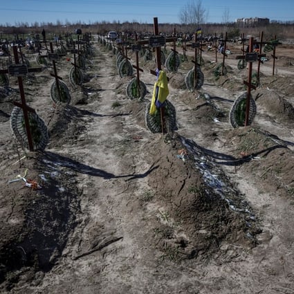 Graves of unidentified people killed by Russian soldiers during the occupation of Bucha. Photo: Reuters