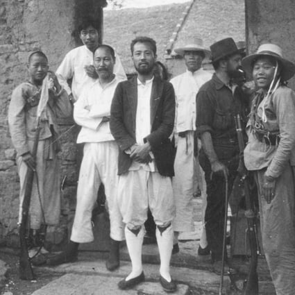Bandits and captives at the Temple of the Clouds at the base of Paotzuku mountain, including Lee Solomon (second right, with cigarette) and former Cambridge student and banker Chi Cheng (centre), following the hijacking of China’s Peking Express. Photo: The State Historical Society of Missouri