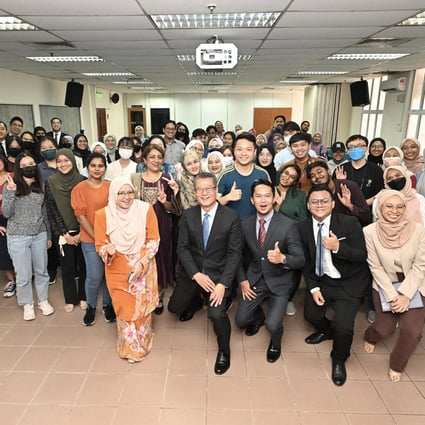 Financial Secretary Paul Chan meets university students in Malaysia. Photo: Handout