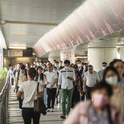 Pedestrians on a footbridge in Hong Kong on April 24. Although Hong Kong’s literacy rate and tertiary education coverage are among the highest in the world, this has not necessarily translated into growing earning potential. Photo: Bloomberg 