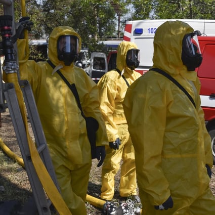 Ukrainian emergency workers wearing radiation protection suits attend training in Zaporizhzhia, Ukraine, on June 7. The nine nuclear-armed states continued to modernise their nuclear arsenals and several deployed new nuclear-armed or nuclear-capable weapon systems in 2022, according to the Stockholm International Peace Research Institute. Photo: AP