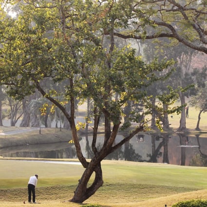 A player lines up a shot at Hong Kong Golf Club. The 172 hectares of parkland, forest and beautiful open spaces for numerous kinds of passive recreation, as well as local and international golfing events, is leased from the government. Photo: Dickson Lee 