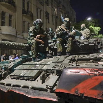 Members of the Wagner Group military company sit atop a tank on a street in Rostov-on-Don, Russia, on Saturday. Photo: AP