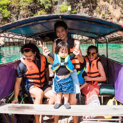 A family of tourists takes a boat trip in Pileh Lagoon, Phi Phi Island, Thailand. A private boat tour around the island came in at No 17 in the sailing and day cruise category on the latest Tripadvisor Travellers’ Choice Awards. Photo: Shutterstock
