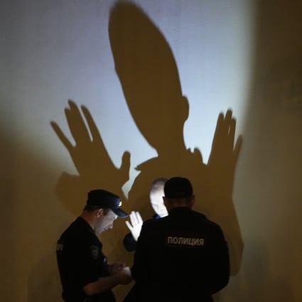 Police check the documents of a man in Moscow on Sunday. A rebellion last weekend saw Wagner troops occupy the city of Rostov-on-Don and then march towards Moscow. Photo: AP