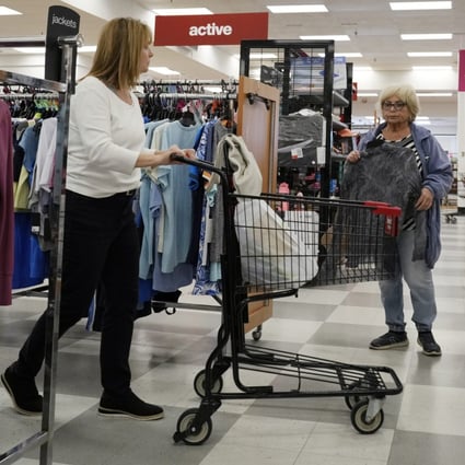Customers shop at a retail store in Vernon Hills, Illinois, on June 12. The highly anticipated US recession still has not arrived as consumers keep spending and employers keep hiring despite higher borrowing costs. Photo: AP