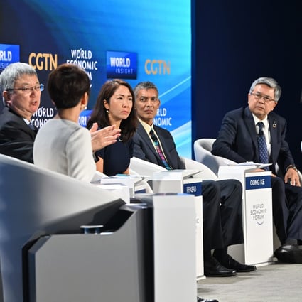 Zhu Min (second left), Eswar Prasad (fourth left) and Gong Ke (second right) during a panel discussion at the World Economic Forum on Thursday in Tianjin. Photo: Xinhua