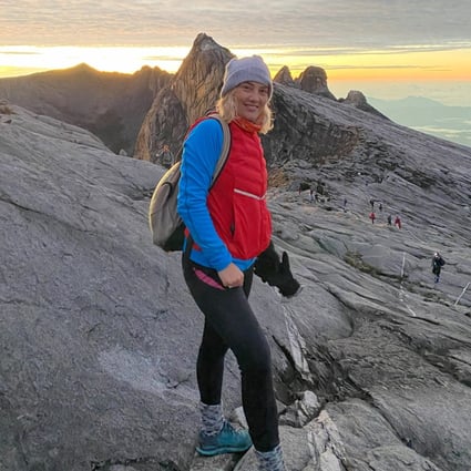 Lise Poulsen Floris on Mount Kinabalu, the highest mountain in Borneo and Malaysia, at sunrise. Conquering the mountain has been part of her journey to becoming a fitter, healthier and happier person. Photo: Lise Poulsen Floris