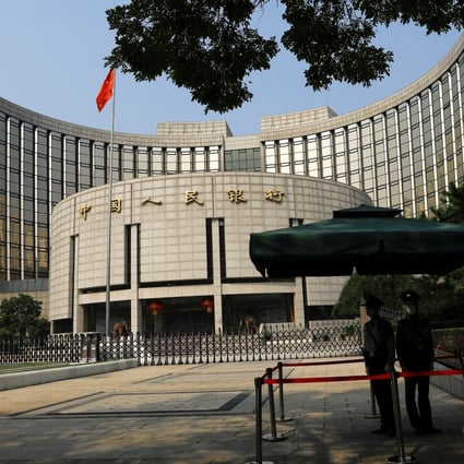 Paramilitary police officers stand guard at the headquarters of the People’s Bank of China in Beijing on September 30 last year. The central bank must hold fast: more monetary accommodation to ease consumers’ debt-servicing pain would not be the best use of China’s valuable resources. Photo: Reuters