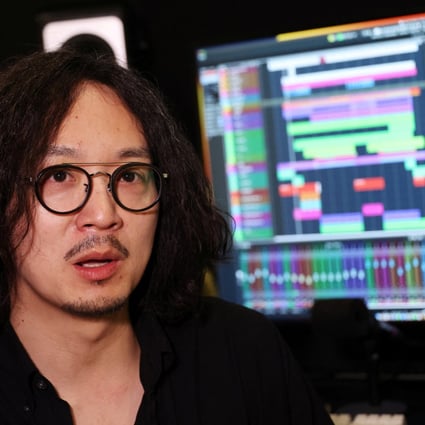 K-pop label Hybe, home to BTS, has released a song by K-pop singer MidNatt in six languages, using AI technology to mix his singing voice with native speakers reading out the lyrics. Above: Chung Wooyong, head of Hybe’s interactive media arm. Photo: Reuters