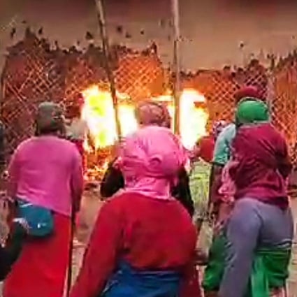 Furious Indian women burn down houses of two suspects after naked