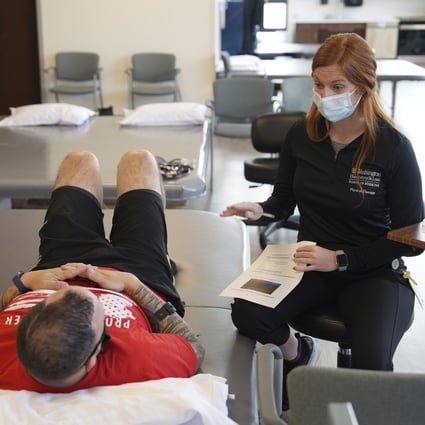 Patients who recover from Covid-19 are suffering cardiovascular problems, including stroke, blood clots and abnormal heartbeat up to a year later. Above: one such patient, Mike Camilleri, works with physical therapist Beth Hughes in St. Louis, Missouri. Photo: AP