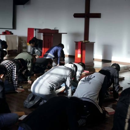Christians pray at the Early Rain Convenant Church in Chengdu. It has been closed by the government. Photo: Facebook