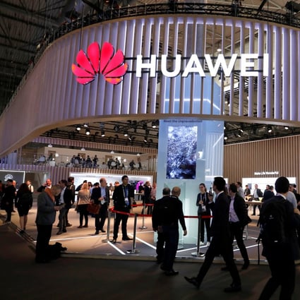 Visitors walk next to a Huawei booth at the Mobile World Congress in Barcelona, Spain, February 27, 2019. Photo: Reuters