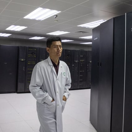 An employee walks next to supercomputers at The National Supercomputer Centre in Jinan, Shandong province. Photo: EPA-EFE