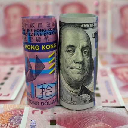 A HK$10 dollar banknote, a US$100 dollar banknote, and 100 yuan banknotes in a picture illustration on January 21, 2016. Photo: REUTERS