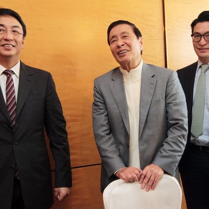 Henderson Land’s Lee Shau-kee is seen here with his sons Peter Lee Ka-kit, left, and Martin Lee Ka-shing, both vice-chairmen at the company. Lee suggested on Wednesday he was considering stepping down and handing control to his sons. Photo: Bruce Yan