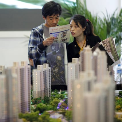 A real estate stand during the 2012 Spring Real Estate exhibition in Shanghai on May 1, 2012. Photo: REUTERS