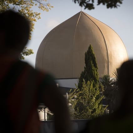 Mourners stand in front of Al Noor mosque in Christchurch, New Zealand. Photo: AP