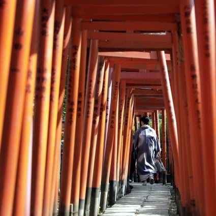 A tourist visits the Otome Inari Shrine in Tokyo. The demand in Japan for accommodation such as hotels has never been higher, according to one industry insider. Photo: Bloomberg