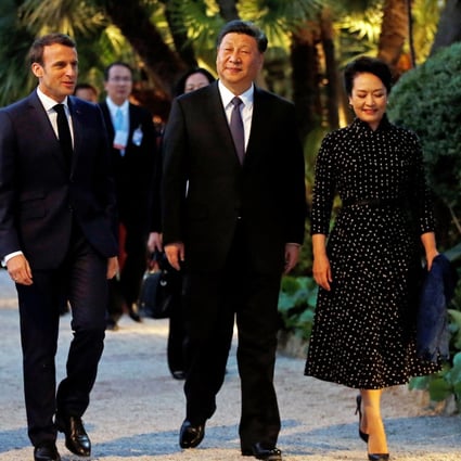 French President Emmanuel Macron and his wife, Brigitte, welcome Chinese President Xi Jinping and his wife, Peng Liyuan, as they arrive for a dinner at the Villa Kerylos in Beaulieu-sur-Mer, near Nice, France, on Sunday. Photo: EPA-EFE
