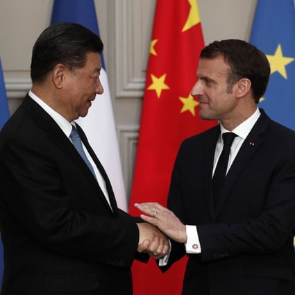Chinese President Xi Jinping shakes hands with his French counterpart Emmanuel Macron after their meeting in Paris on Monday. Photo: EPA-EFE