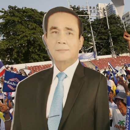 Supporters of the Palang Pracharat party hold a poster of Thai Prime Minister Prayuth Chan-ocha. Photo: AP