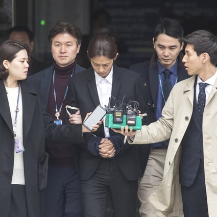 Jung Joon-young (centre), flanked by two policemen, attends court. Photo: EPA-EFE/Kim Chul-soo