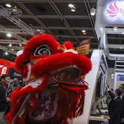 A Lion dance passes by the Huawei booth at the Hong Kong Convention and Exhibition Centre in Wan Chai, March, 2019. Photo: SCMP