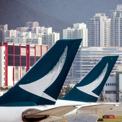 The Cathay Pacific logo on the tails of passenger planes at Hong Kong International Airport. Photo: Bloomberg