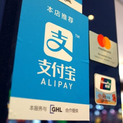Signage support the use of Ant Financial Service Group’s Alipay smartphone-enabled payment platform, along side MasterCard and China UnionPay in Hong Kong. Photo: SCMP