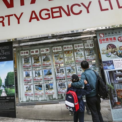 Property prices are listed at a real estate agency in Happy Valley. Photo: Jonathan Wong