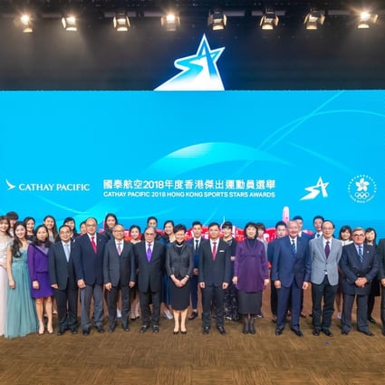 Chief Executive Carrie Lam presents at the awards ceremony