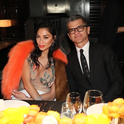 Fendi chairman and CEO Serge Brunschwig with singer Nicole Scherzinger at a dinner during Art Basel Hong Kong.